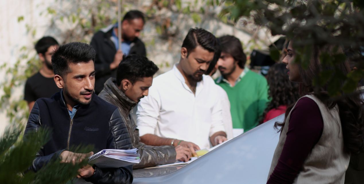 The director Asim Abbasi and Sanam Saeed on the set of 'Cake'.